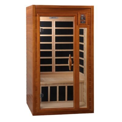 Freestanding infrared sauna placed in a calm residential wellness room with soft lighting, natural textures.