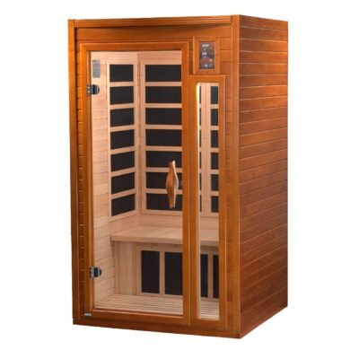 Freestanding infrared sauna placed in a calm residential wellness room with soft lighting, natural textures.