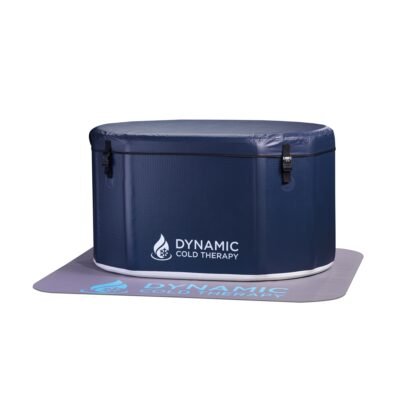 Dynamic Cold Therapy inflatable oval cold plunge tub with insulated lid and safety latches, shown on branded non-slip mat.