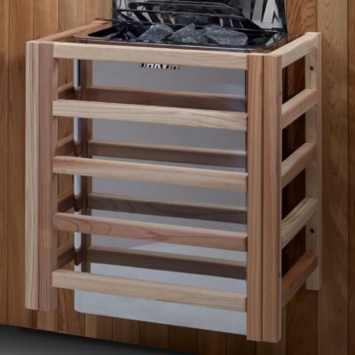 Harvia wall-mounted sauna heater with stone basket and wooden safety guard inside cedar sauna.