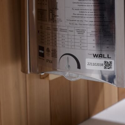Harvia Wall sauna heater rating label close-up with model details and electrical specifications.