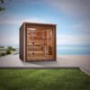 Golden Designs 3 person outdoor traditional sauna installed on modern patio overlooking water